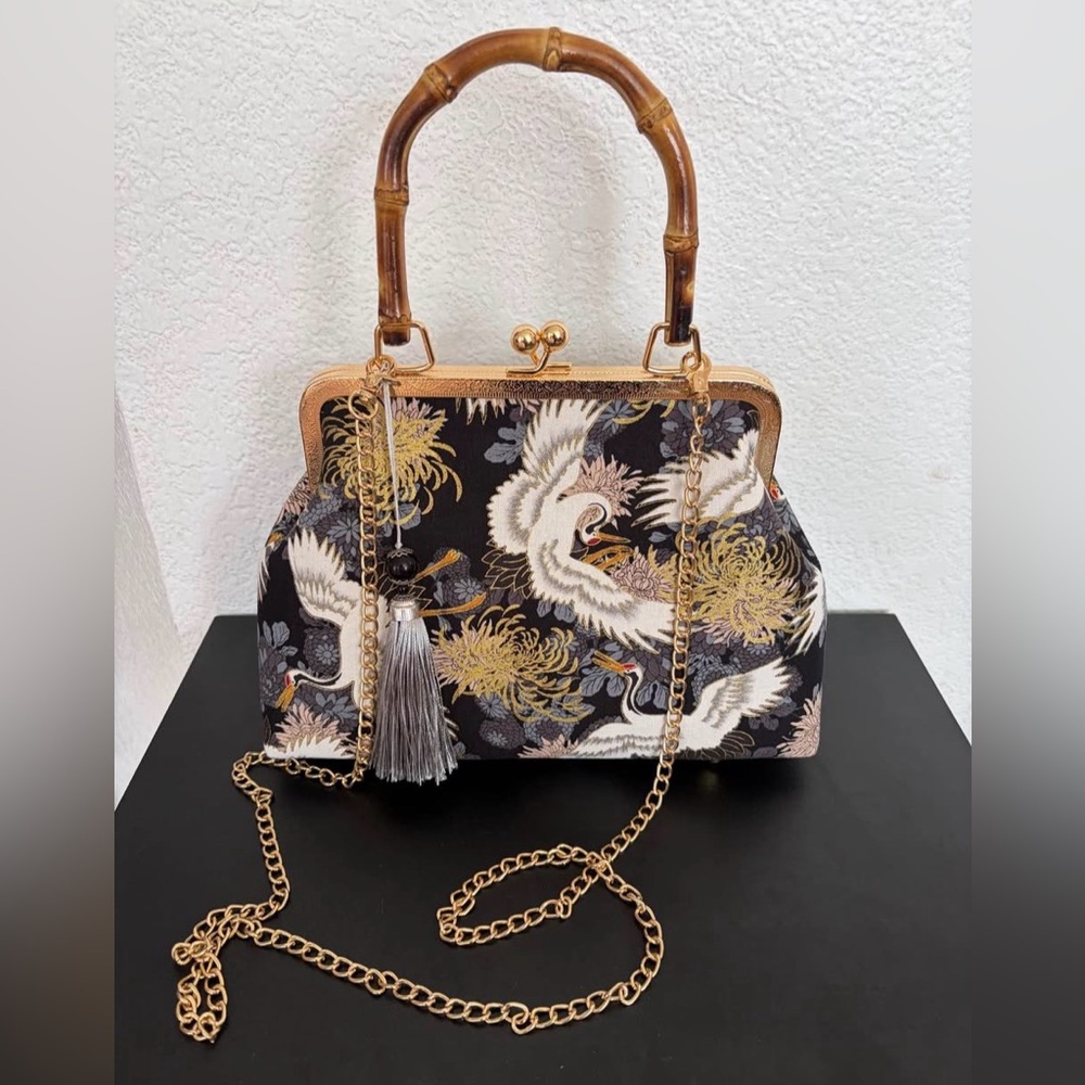 Elegant Black and Gold Handbag with Chain Strap